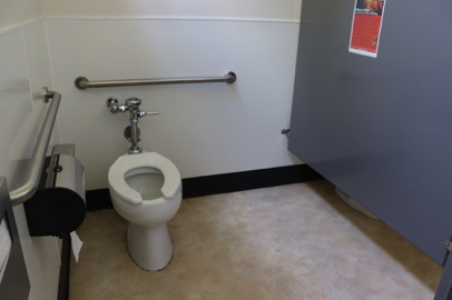Education Center – accessible restroom stall – grab bars – toilet paper dispenser – sink – garbage